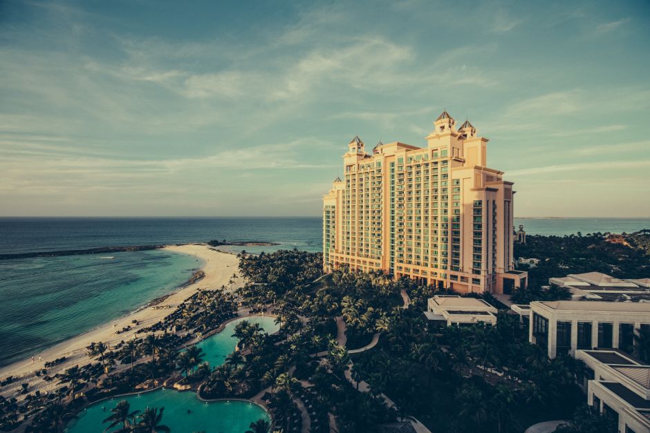 Landscape image of a luxurious holiday resort situated on a picturesque beach front.