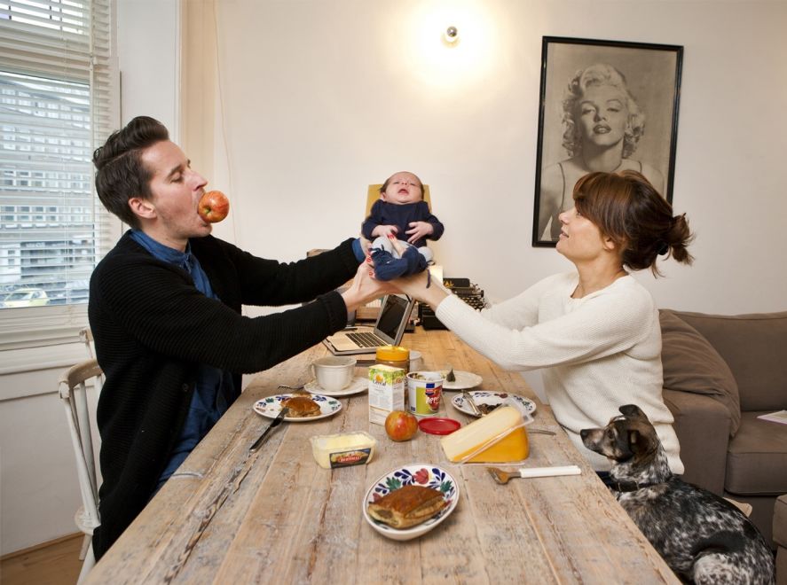 two people sitting at a table with food