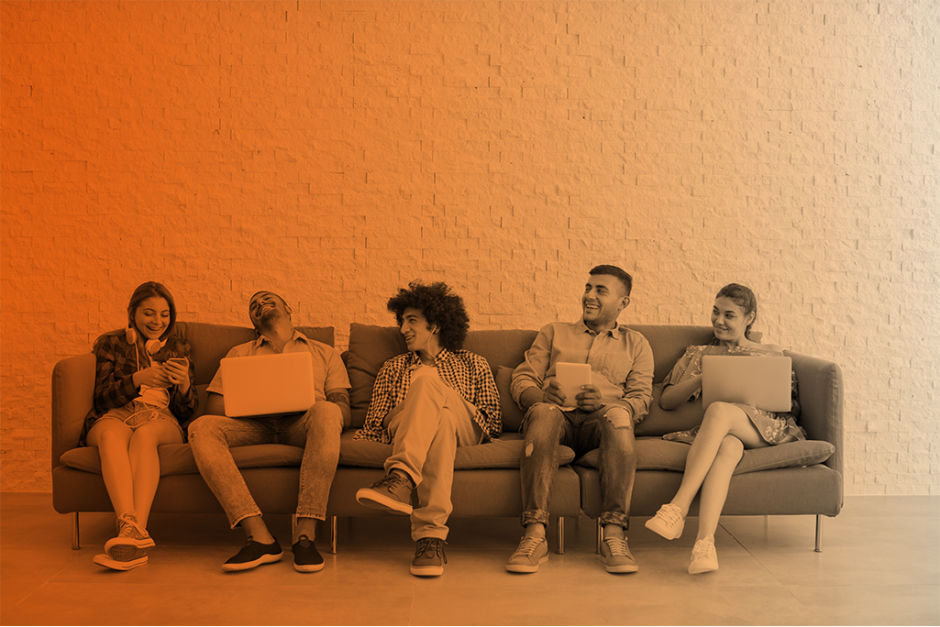 people sitting on a sofa and conversing