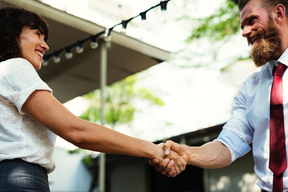man and woman shaking hands
