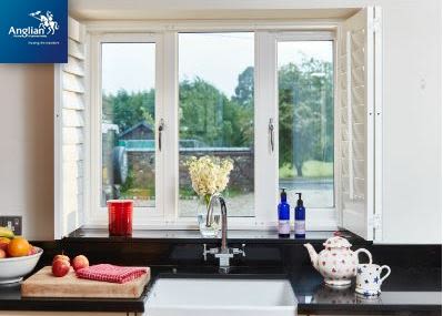 Anglian logo with campaign image of kitchen windows
