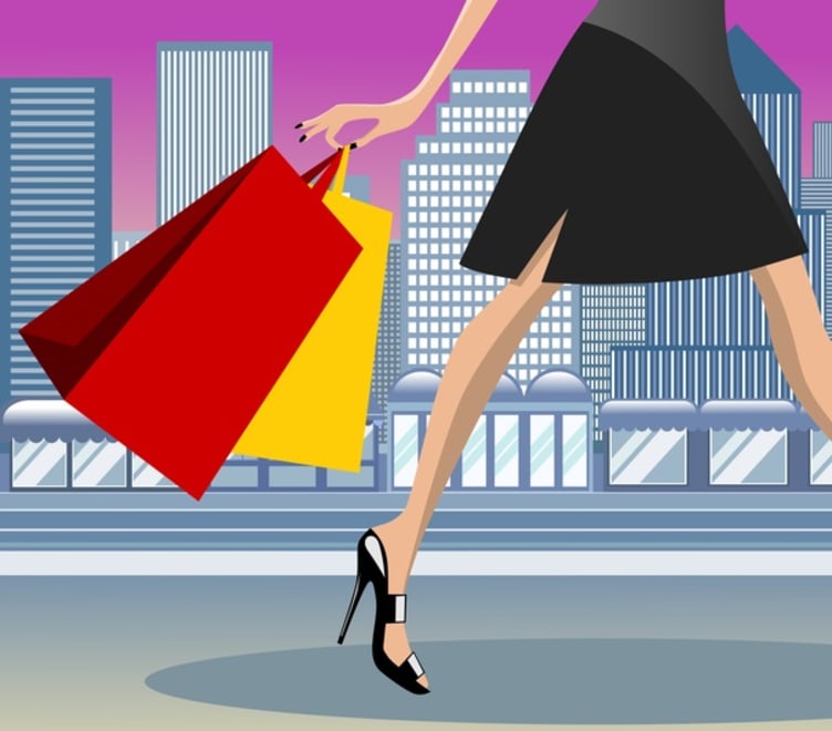 An image of an animated lady walking with shopping bags against a commercial area backdrop.