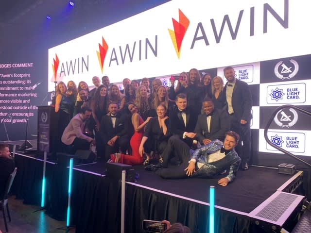 Awin team celebrate on-stage at the PMAs