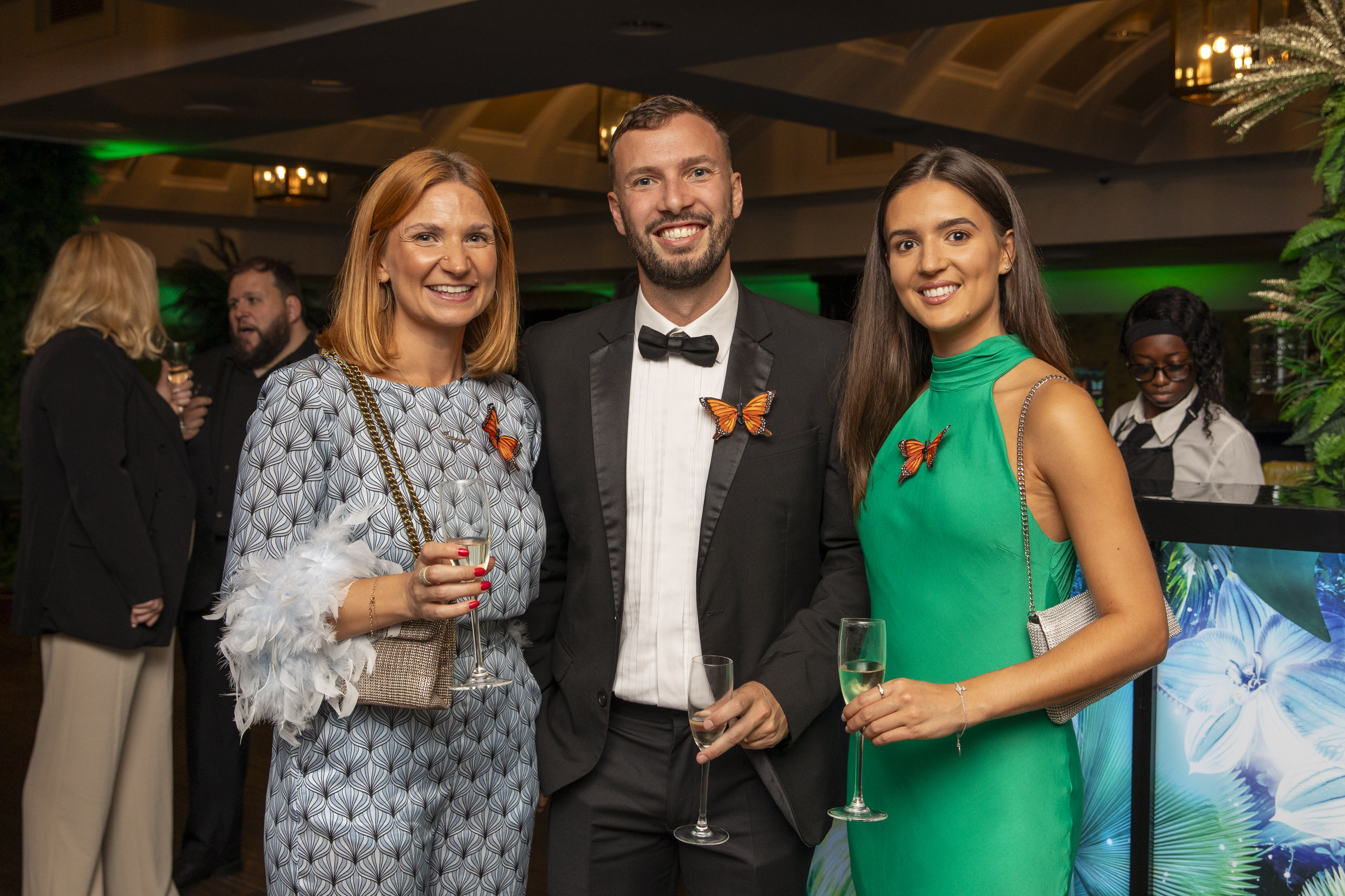 Guests pose and smile for a picture 